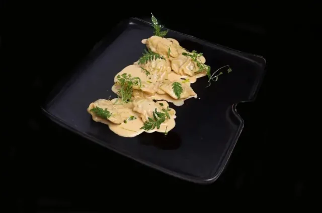 Dumplings with black codfish in caviar sauce